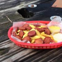 Salchipapa · French fries and slice hot dogs.