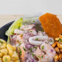 Seafood · Marinated in lime juice, cilantro and red onions served with sweet potato and Peruvian corn.