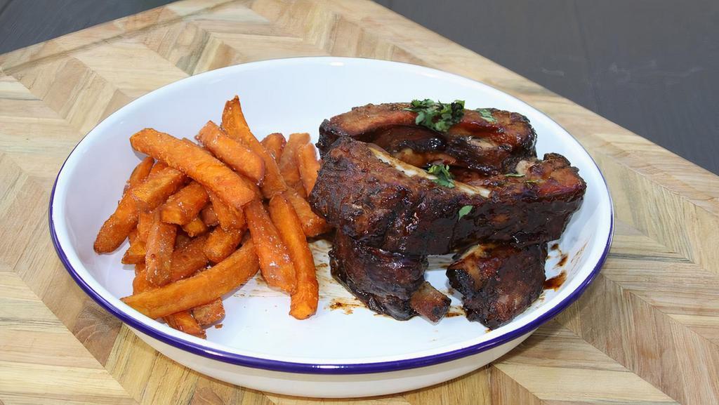 Baby Back Ribs · With sweet potatoes and fries.