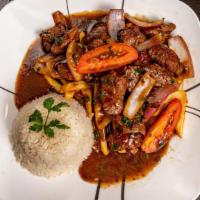 Sauteed Chicken Tenderloin/ Chicken Saltado · Beef tenderloin cut in dices, stir-fried with tomatoes and onion, flambé with pisco, soy sau...