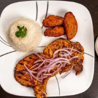 Pork Chops/ Chuletas De Puerco · Cutlet grilled pork chops. Served with two sides (salad, rice, tostones, or French fries).