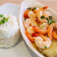 Shrimps In Garlic Sauce · Large shrimps made with fresh garlic and white wine served with white rice.