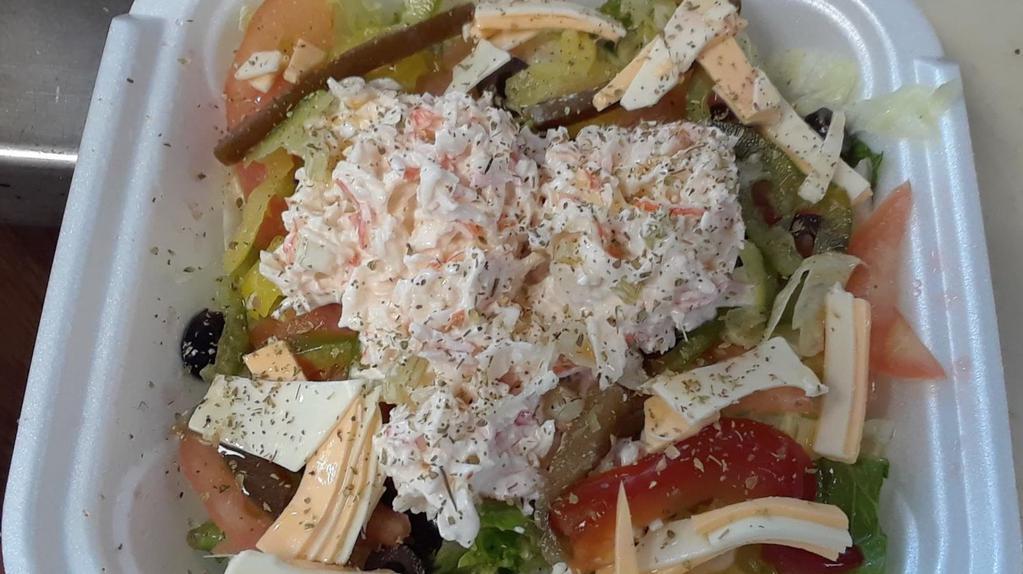 Seafood · Crab and Seafood Meat Marinated with Mayonnaise and Freshly Chopped Celery Sticks with your choice of toppings and a dressing.