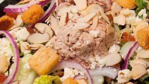 Tuna Garden · Tuna salad, fresh greens, tomatoes, cucumber, red onions, feta cheese, almonds, croutons, an...