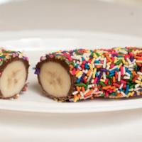 Frozen Bananas With Nutella · Frozen banana coated with nutella and sprinkles.