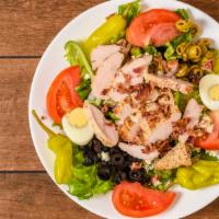 Cobb Salad · Tomatoes, red onions, green peppers, cucumbers, blue cheese, crumbles, bacon, grilled chicke...