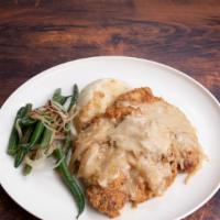 Smothered  Chop · Smothered pork chops, With your choice of two sides.