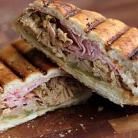 Cuban Sandwich · This sandwich includes but is not limited; roasted pork, lettuce, butter, honey-glazed ham, ...