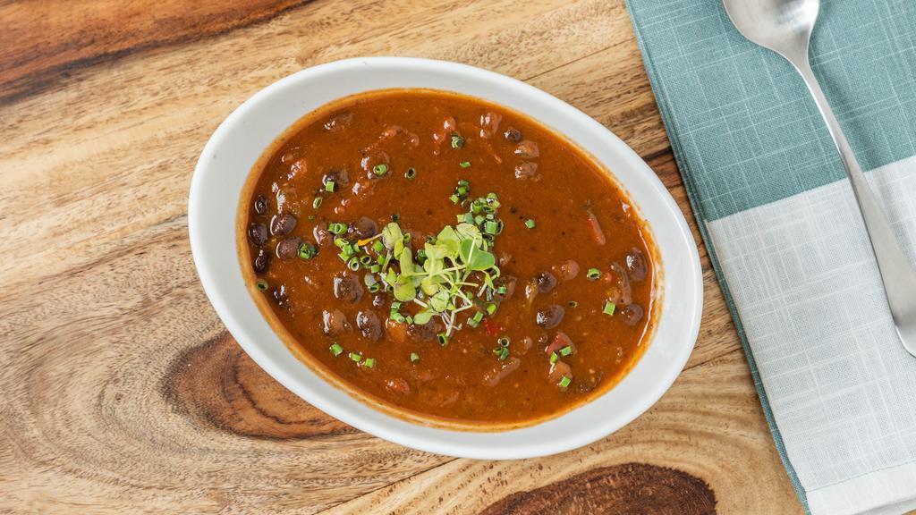 Black Bean Soup · Gluten free. Stewed black beans with peppers, red onions, and herbs.