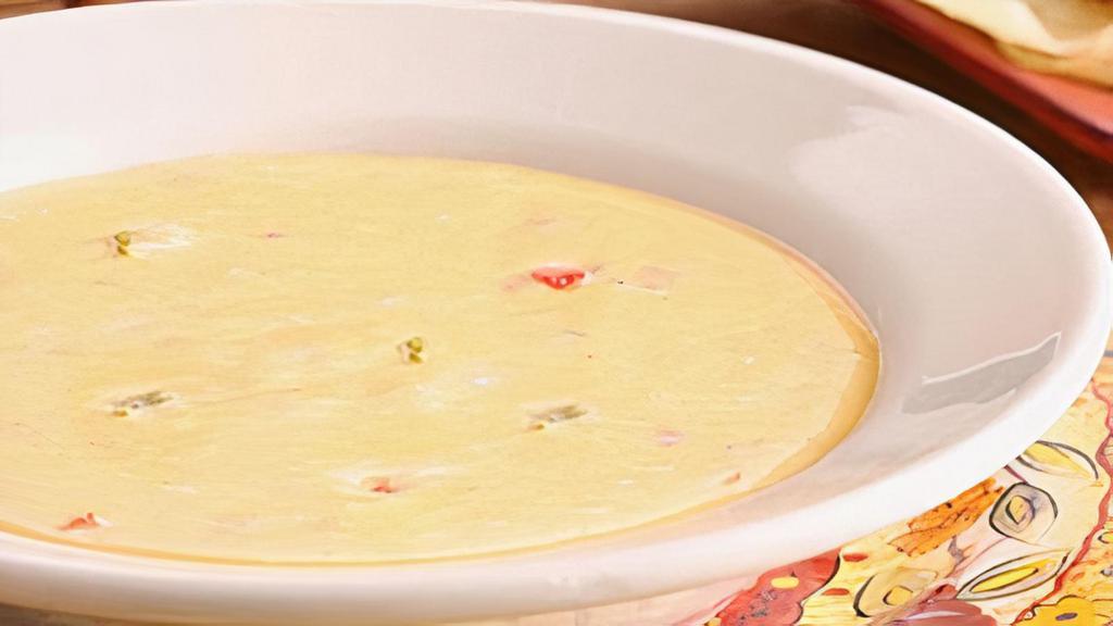 Chile Con Queso · Our signature, handcrafted and deliciously creamy cheese dip.