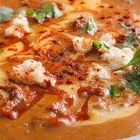 Queso Diablo · A flavorful cheese dip made with seasoned ground beef, slow-roasted peppers and chiles, topp...
