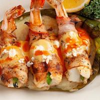 Bacon-Wrapped Stuffed Shrimp · Fire-grilled shrimp, wrapped in hickory smoked bacon and stuffed with fresh jalapeño. Served...