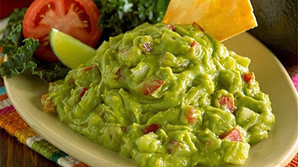 Guacamole - Regular · Hand-mashed whole avocados, seasoned to perfection with lime juice, onions and diced tomatoes for a delicious guacamole.