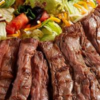 Fajita Salad · Crisp, fresh garden greens with grilled onions and peppers, topped with your choice of fire-...