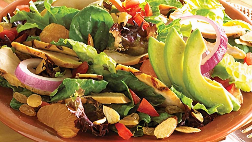 Grilled Chicken Salad · Fire-grilled chicken, mandarin oranges, honey-roasted almonds, tomatoes, raisins and avocado slices, mixed with fresh garden greens. Served with honey mustard dressing on the side.