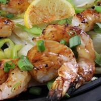 Shrimp Fajitas · Fire-grilled shrimp basted with our Mexican-style barbeque sauce served with grilled onions ...