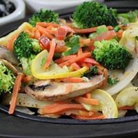 Vegetable Fajitas · Fire-grilled garden-fresh vegetables served with cilantro lime rice, black beans, homemade g...