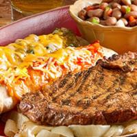 Steak And Enchiladas · Fire-grilled steak* cooked to order with your choice of two hand-rolled enchiladas. Served w...