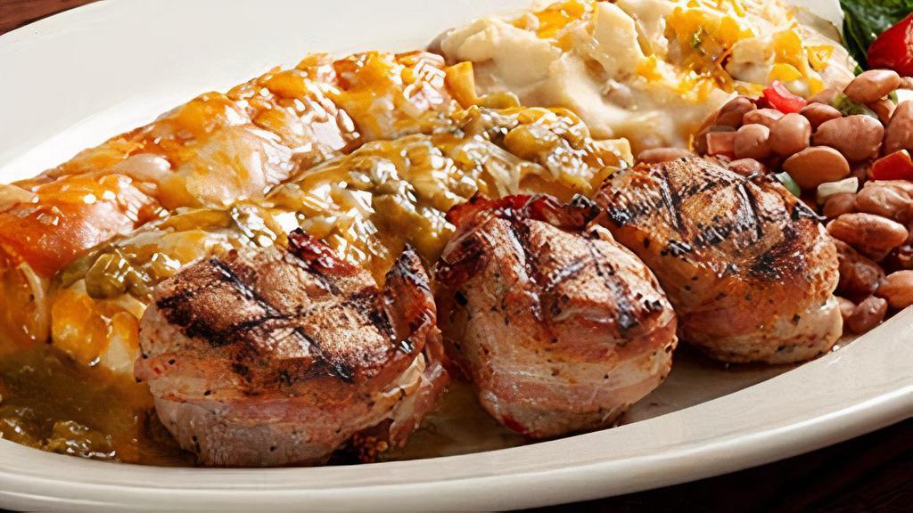 Pork Tenderloin Abrigada · Three fire-grilled pork tenderloin medallions, wrapped in hickory smoked bacon. Served with your choice of two hand-rolled enchiladas, Papas con Chile™ and charro beans.