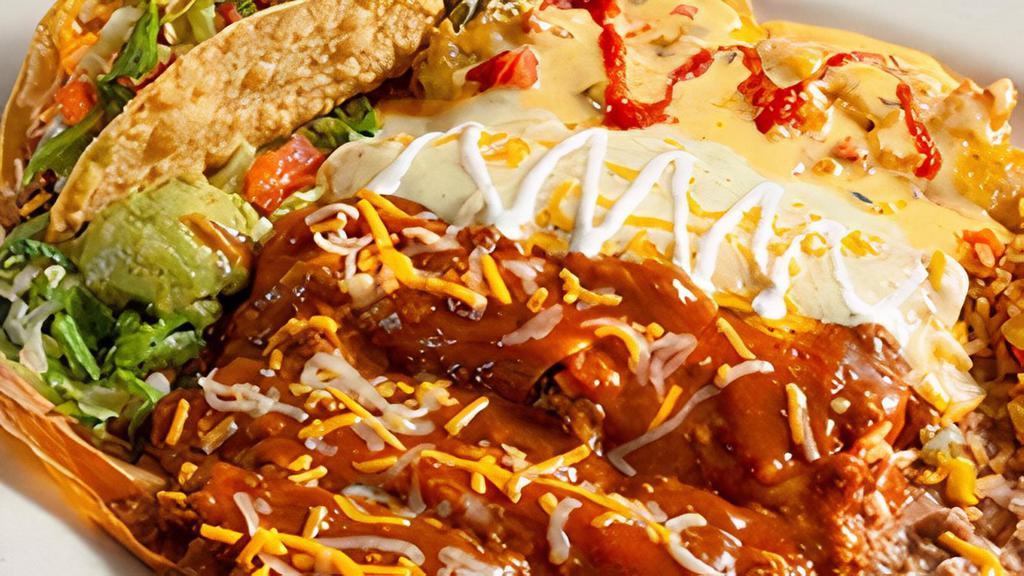 The Grande · Three hand-rolled enchiladas—one beef, one cheese and one sour cream chicken—a cheese chile relleno, tamale, crispy beef taco and our fresh handmade guacamole. Served with refried beans and your choice of Papas con Chile™ or Mexican rice.