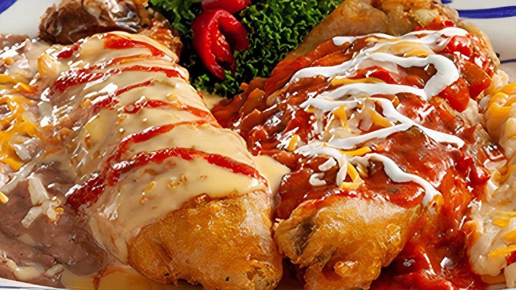 Chile Rellenos Dinner · Two chile rellenos—blended cheese or shredded beef— topped with your choice of ranchera sauce or chile con queso.  Served with refried  beans  and  your choice of Papas con Chile™ or  Mexican rice.