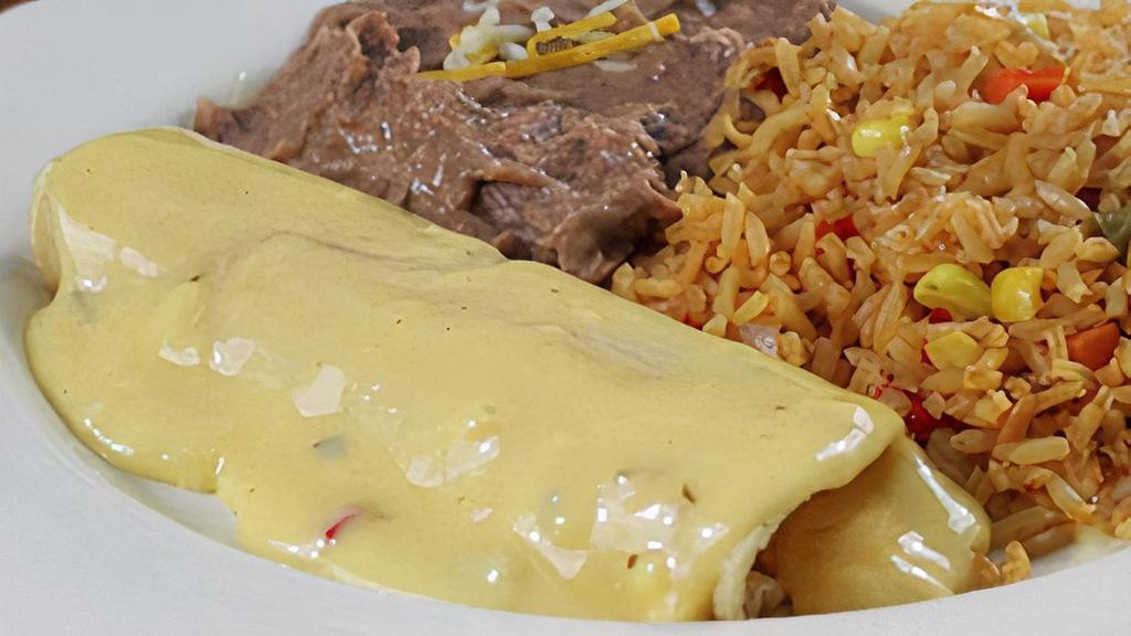 Kid'S Enchilada With Queso · A cheese enchilada topped with chile con queso and served with French fries, or refried beans and Mexican rice.