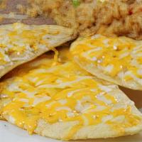 Kid'S Cheese Nachos · A child's portion of cheese nachos, served with French fries, or refried beans and Mexican r...