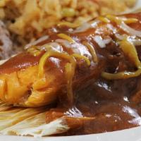 Kid'S Tamale · A beef tamale topped with chile con carne and mixed cheese. Served with French fries, or ref...