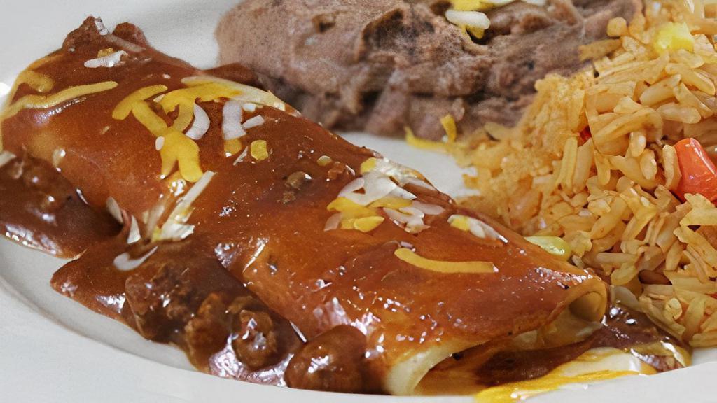 Kid'S Cheese Enchilada With Meat Sauce · A cheese enchilada topped with chile con carne and served with French fries, or refried beans and Mexican rice.