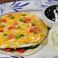 Vegetarian Quesadilla Al Horno · Oven baked quesadilla filled with vegetables and topped with blended cheeses. Served with ci...
