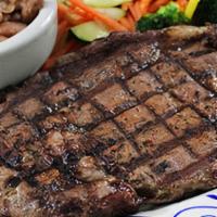 Gluten-Sensitive Steak · Fire-grilled steak cooked to order and served with charro beans and seasonal vegetable medley.