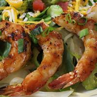Gluten-Sensitive Shrimp Fajita Salad · Barbeque shrimp served over fresh green salad with a variety of mixed cheeses, diced fresh t...