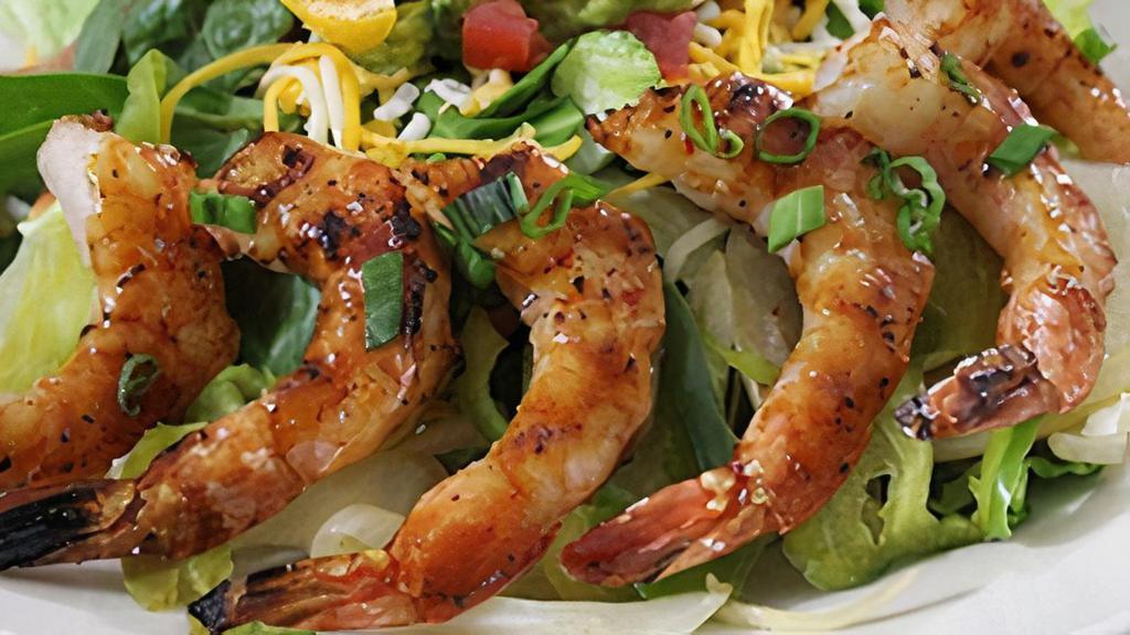 Gluten-Sensitive Shrimp Fajita Salad · Barbeque shrimp served over fresh green salad with a variety of mixed cheeses, diced fresh tomatoes and fresh guacamole.