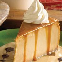 Dulce De Leche Cheesecake · Our signature creamy cheesecake whipped with Mexican caramel and served with leche quemada, ...