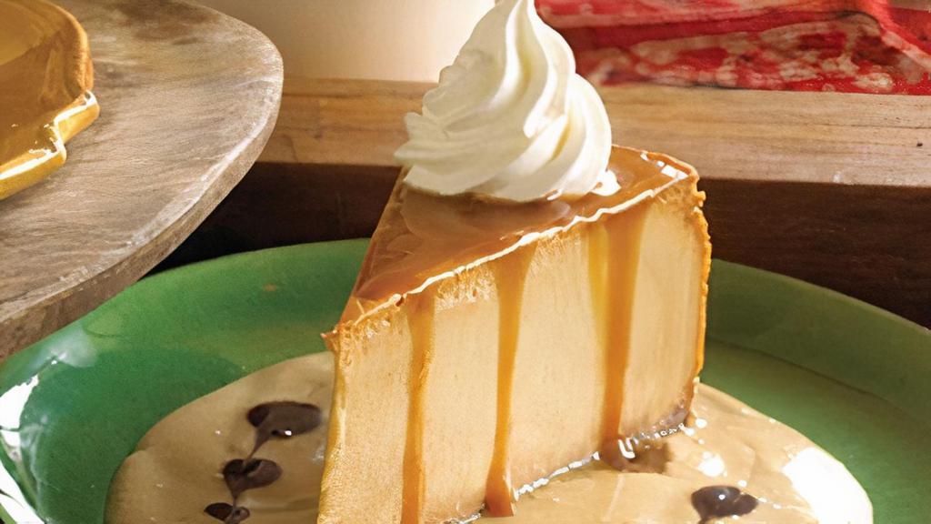 Dulce De Leche Cheesecake · Our signature creamy cheesecake whipped with Mexican caramel and served with leche quemada, a traditional sweetened milk sauce.