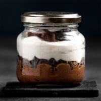 Ferrero Mousse · Chocolate mousse, hazelnut cream, whipped cream and Ferrero candy.