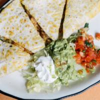 Grilled Chicken Quesadilla · 10 inch griddled tortilla served with lettuce, pico de gallo and sour cream.