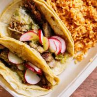 Carnitas Taco Plate · 2 pork tacos with fresh radish and salsa verde.
Choice of hard shell, soft corn or flour tor...