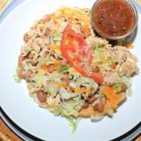 Tostada · Chicken, Beans, Lettuce, cheese & tomatoes.