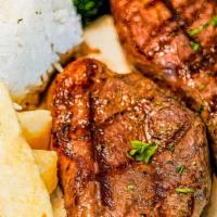 Punta De Anca · Grilled cap of sirloin steak picanha (12oz). Served with white rice, fried yuca, garlic mojo...