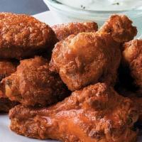 Chicken Wings · Order of big and meaty chicken wings served classic Buffalo style or tangy BBQ style.