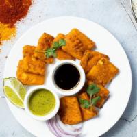 Paneer The Solution · Tofu cubes dipped in a light batter and fried until golden brown.