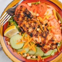 Grilled Salmon · Iceburg, romaine and iceburg coupled with warm grilled salmon, tossed with shredded carrots,...