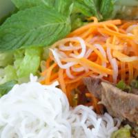 Bún Thịt Nướng · Dry rice-vermicelli with BBQ pork. (Comes with carrots, dykom, lettuce, bean sprouts, cucumb...