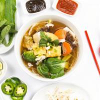 Phở Chay-Vegetarian Phở · A vegetarian version of phở. Served with, carrots, napa cabbage, broccoli, mushrooms, bok ch...
