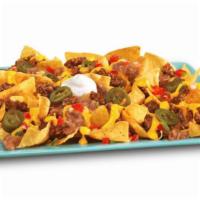 Beef Super Nachos · Seasoned ground beef, cheese sauce, salsa, jalapenos, refried beans and sour cream on top of...