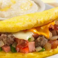 Meat Omelette · three-egg omelette w/ choice of meat, cheese with grits or a hash brown, toast and small dri...