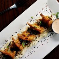 Dynamite Shrimp & Grits · Jumbo fried shrimp, wasabi grits, 'Casian