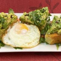 Avocado Toast · Toasted butter bread topped with avocado mash, sesame seeds and a sunny side up egg and bals...