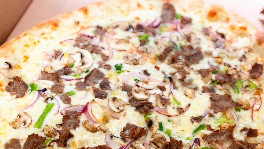 Milly Rocks (Philly Cheese Steak Pizza) · Philly steak sautéed with onions, mushrooms, green peppers, topped with mozzarella and provolone cheese.